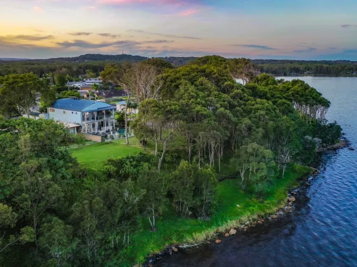 DUAL LIVING WATERFRONT RESERVE WITH ELEVATED LAKE/OCEAN VIEWS