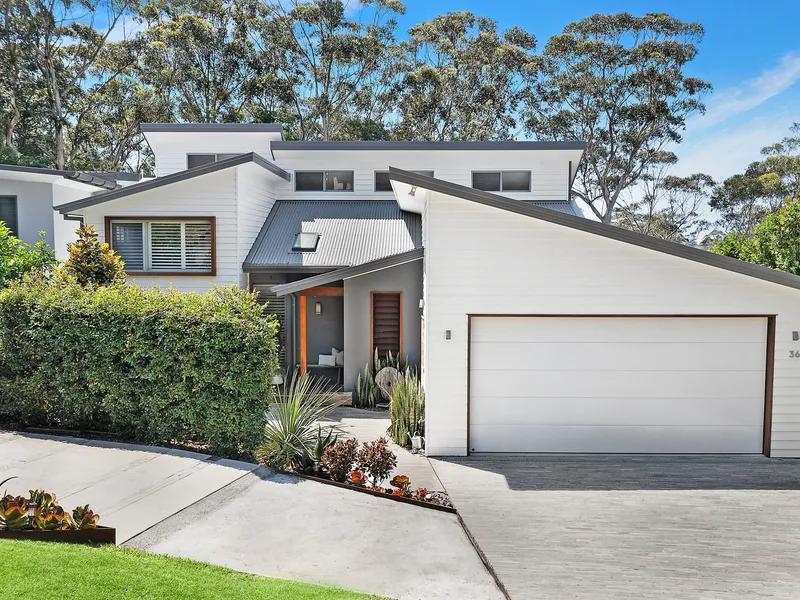 Beautifully design family home on serene lagoon front position
