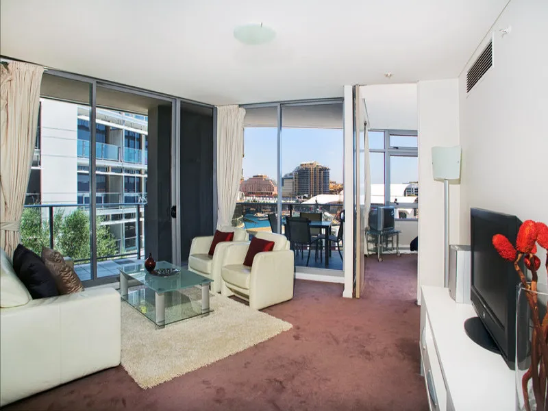 Beautifully furnished three bedroom King Street Wharf apartment