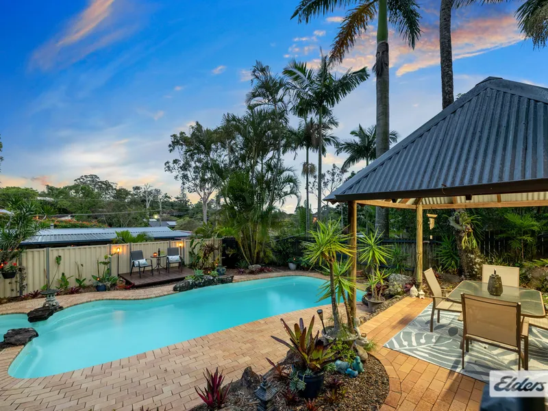 Luxurious Tudor Retreat on Expansive Half-Acre Oasis: Executive Living in Redland Bay