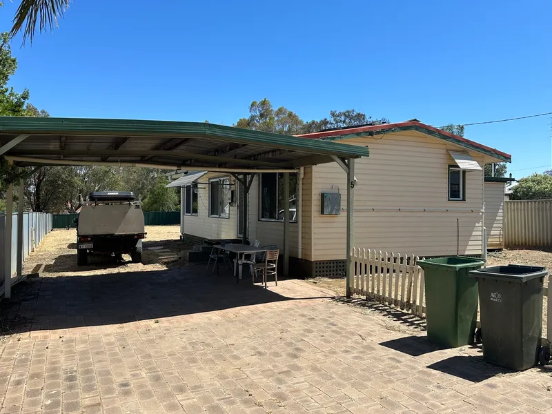 Bargain affordable home in great location on a potential development block.