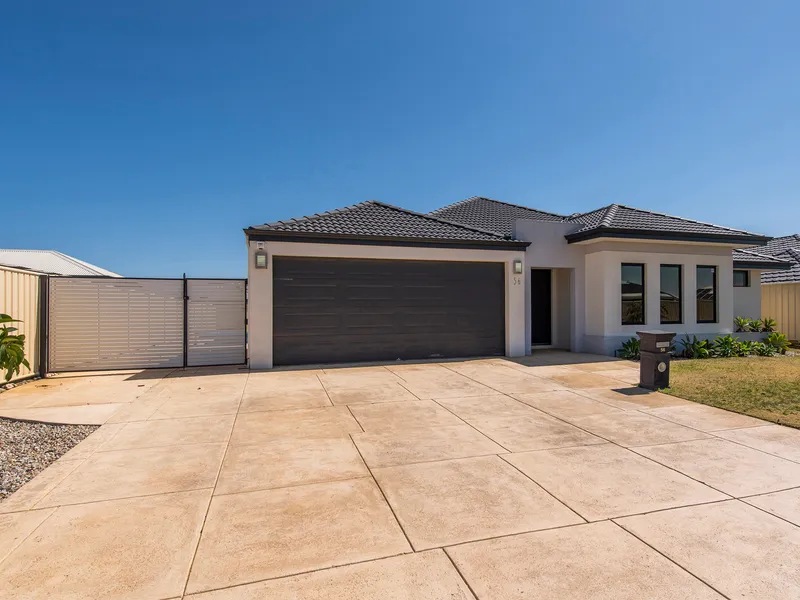 Contemporary house with sparkling pool.