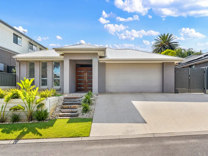 LIGHT-FILLED 4-BED, 2-LIVING FAMILY HOME IS SECLUDED SUBURBAN STUNNER