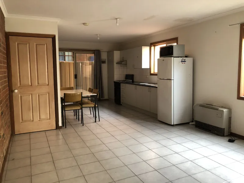 2 bedroom townhouse located behind shop