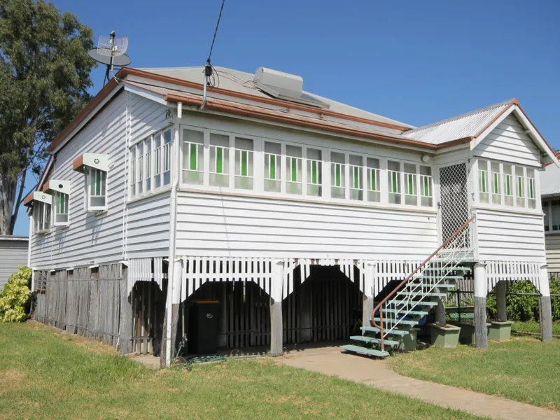 A CLASSIC HIGH SET WEATHERBOARD HOME WITH A PINE INTERIOR - SHED - REAR LANE ACCESS.
