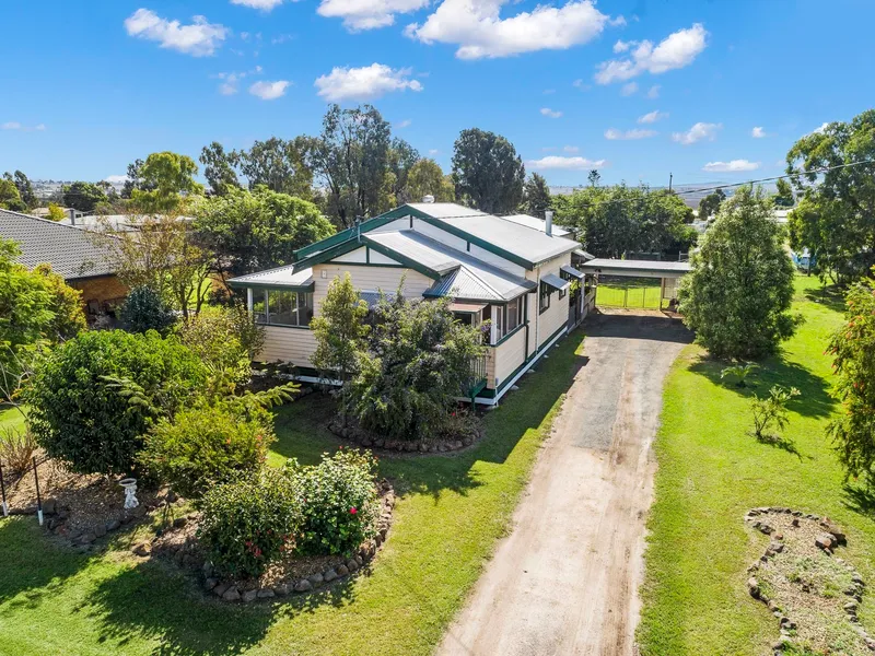Beautifully Presented Home With Huge Shed Hits The Cambooya Market!