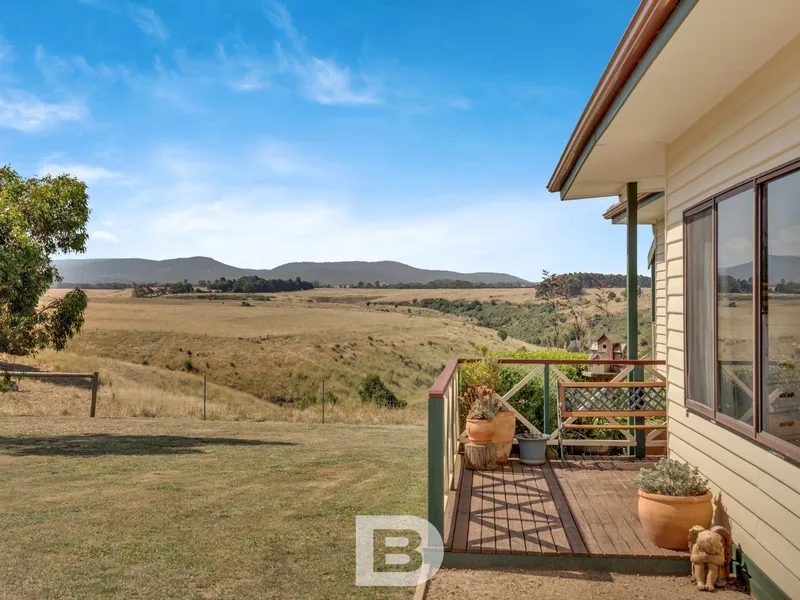 Quaint and character filled with stunning views – 24 acres approx.