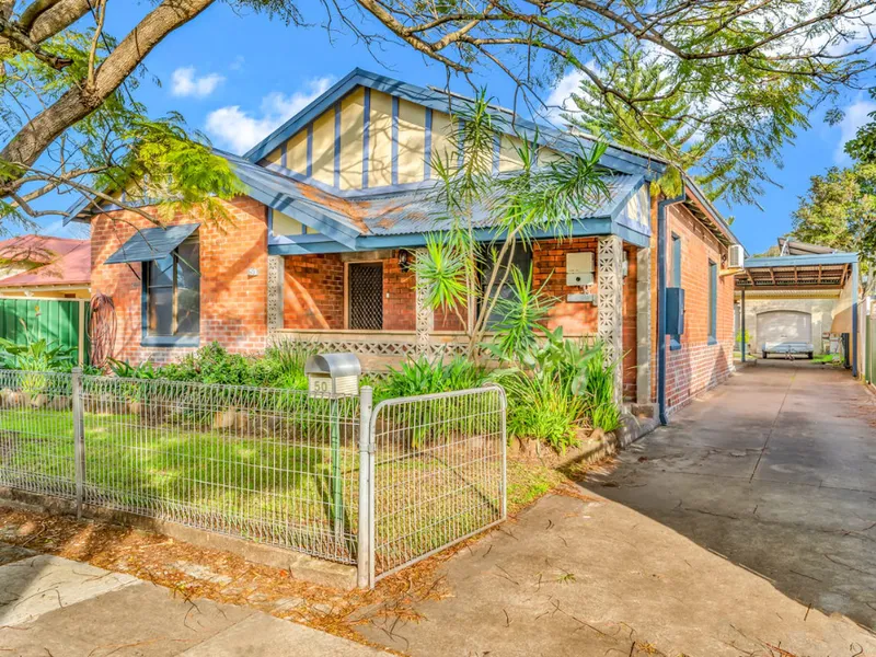 GOOD SIZE FAMILY HOME WITH COVERED ALFRESCO AREA WITH GARAGE PLUS WORKSHOP