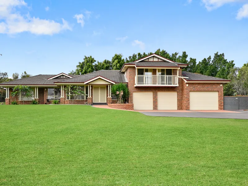 Impressive split level family home privately set on a 1 acre block