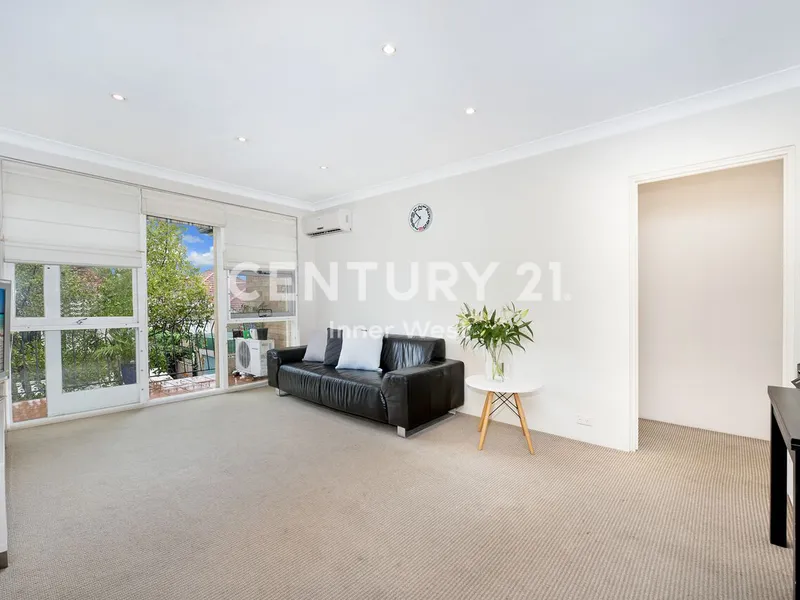 Contemporary Top Floor Two Bedroom Unit Located in a Well Maintained Block.