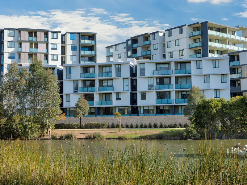 Light and quality with lake view & timber floor throughout