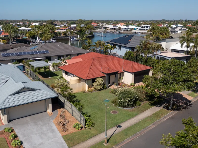 Charming 4-Bedroom Brick Home in Prime Banksia Beach Location With Side Access