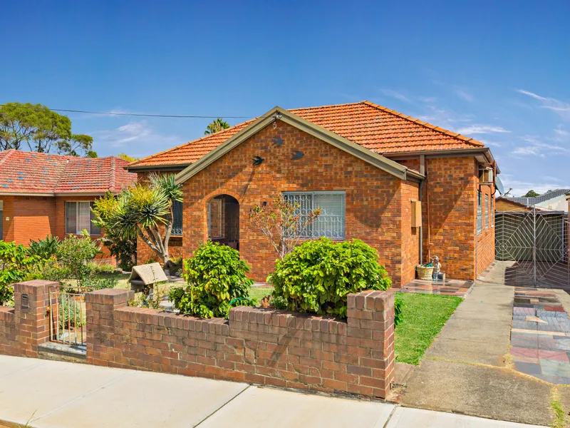 Double brick family home offering space, peace and comfort throughout.