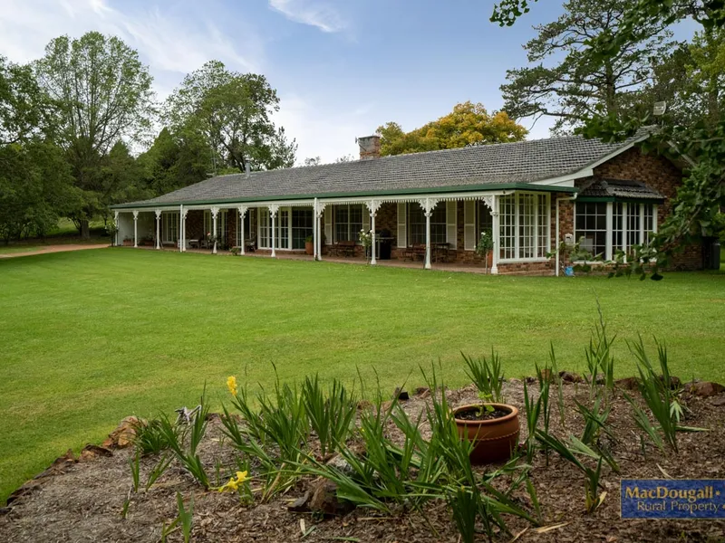 The home sits amongst 4,000 square metres of gorgeous gardens, while the surrounding land covers 15 hectares of undulating grazing country...