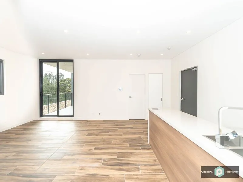 Near New 2 Bedroom Apartment with Double Car Spaces