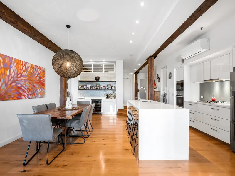 Private and peaceful renovated Woolstore living with perfect north-east aspect.