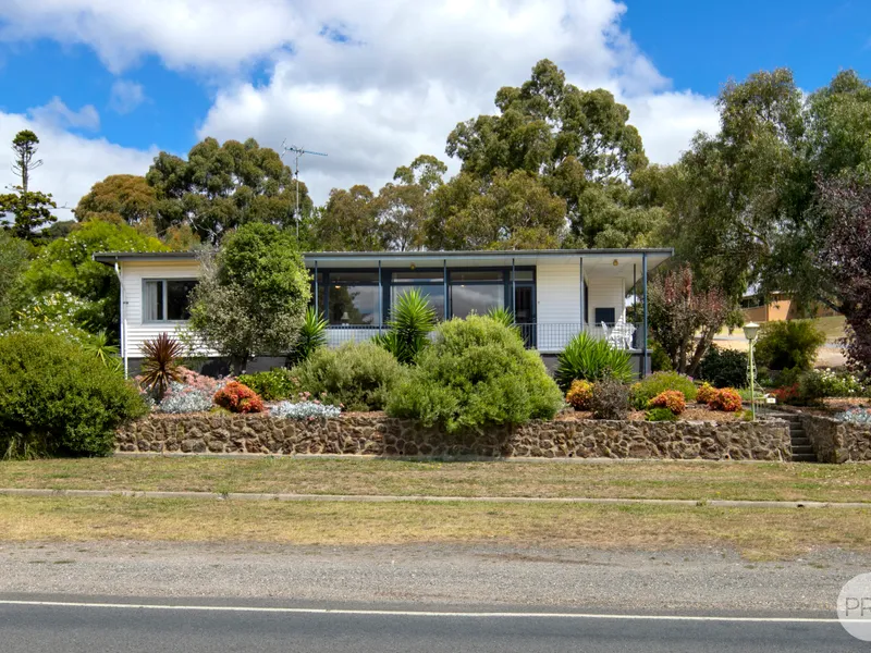 Elevated Home On Large Corner Block With Views