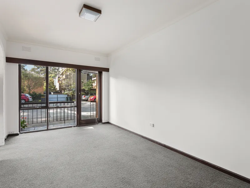 FRESHLY PAINTED 2 BEDROOM APARTMENT WITH PARKING.