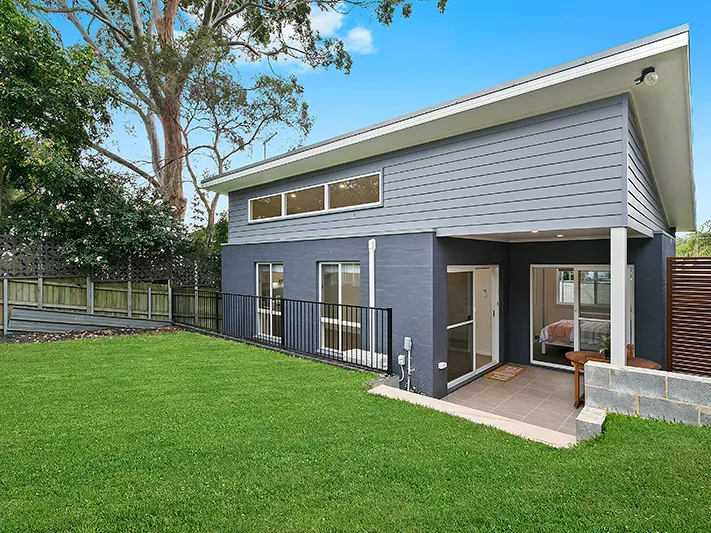 Stunning designer home with fully enclosed yard in idyllic location