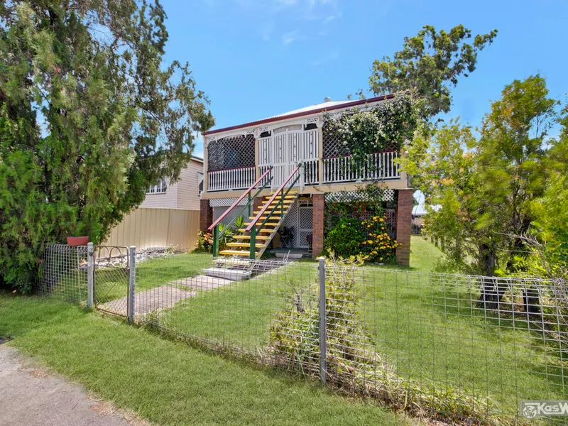 MAGNIFICENT DOUBLE STOREY COLONIAL HOME - OPEN FRONT VERANDAH - INTERNAL STAIRS - PRIME BRUCE HIGHWAY FRONTAGE.