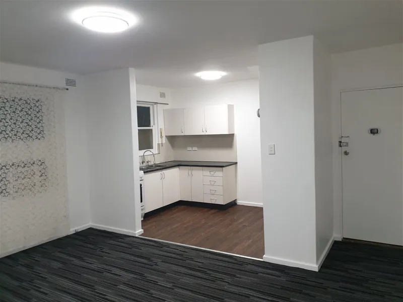 Elevated 1st floor renovated 2 bedroom security unit with Garage - Available now