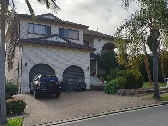 Large Two storey residence on high side of street.