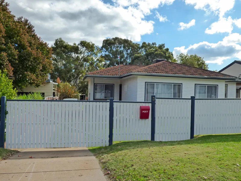 Three bedroom home in quiet South location, just a walk to shops, schools, tavern