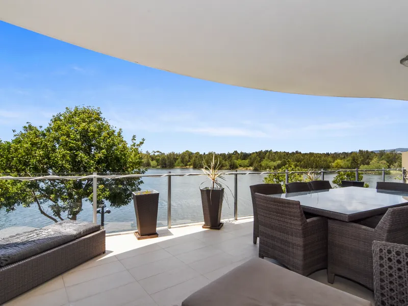 Waterfront, Emerald Lakes,  elevated ground floor apartment, two bedrooms plus a study nook