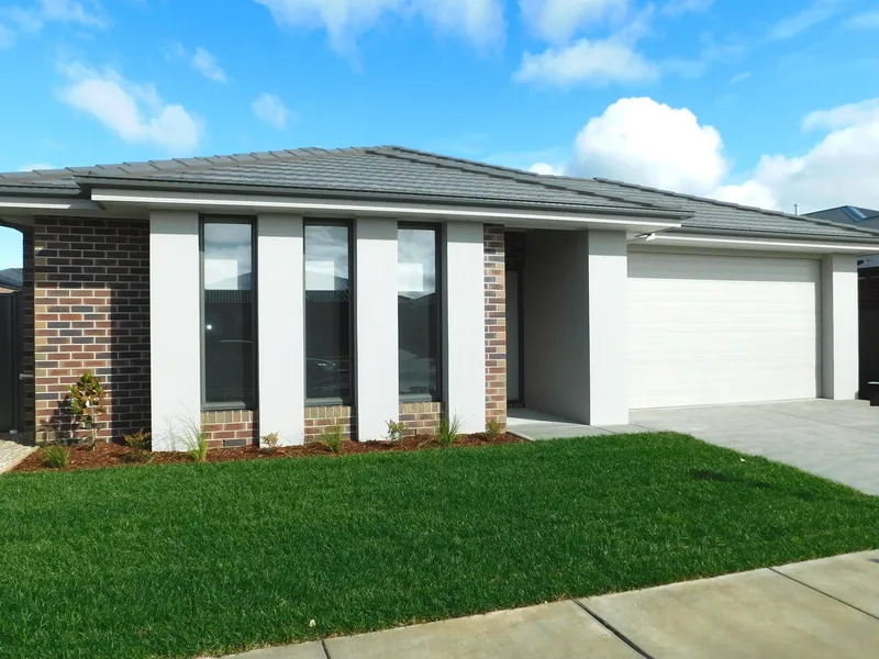 LUXURY NEW HOME FEATURING TWO LIVING AREAS AND FULLY LANDSCAPED GARDENS