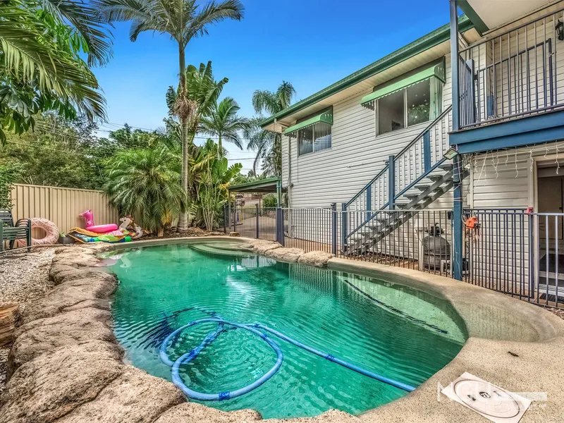 TWO LEVELS OF LIVING + POOL + SHEDS !! In Quiet Central Location