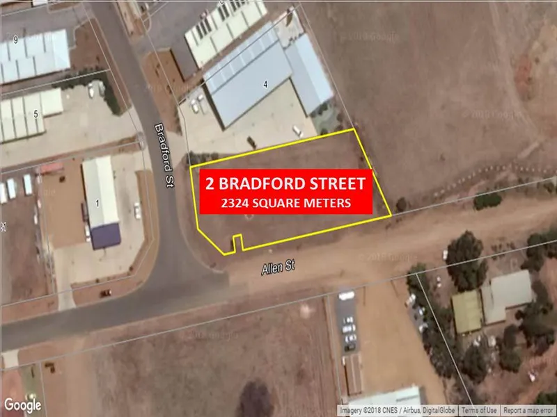 HEAVILY REDUCED TO SELL! LEVEL LOT IN LIGHT INDUSTRIAL AREA