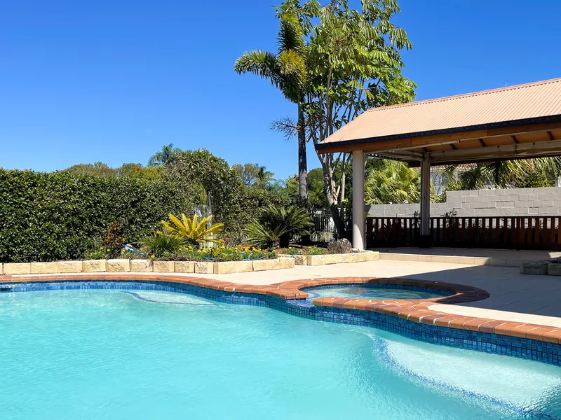 Prestigious Home Overlooking Palm Meadows Golf Course!