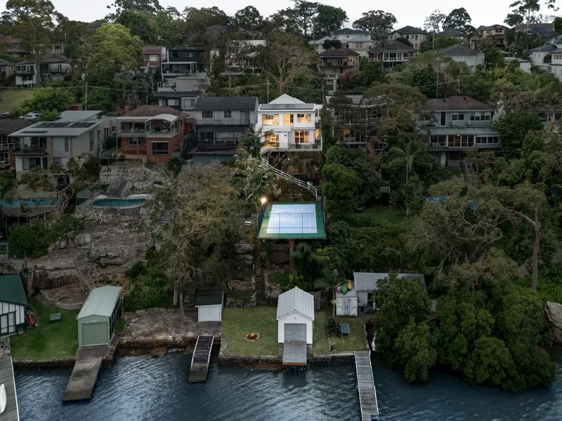 Luxuriously renovated double brick waterfront home with level street access and sweeping views of the Georges River