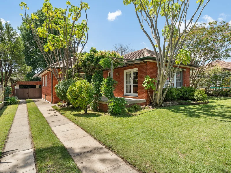 Spacious and light-filled full brick family home offers easy living in a prime street