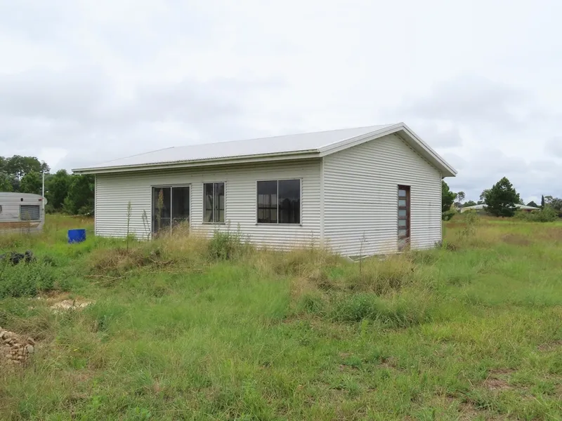12 ACRES with Partly Finished Steel Framed Cottage