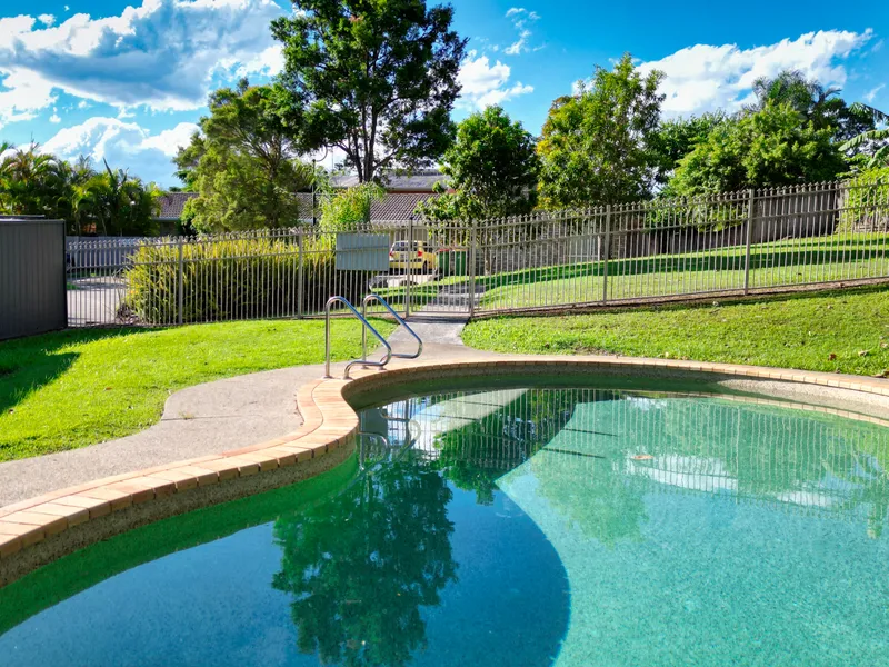 PRIVATE AND PEACEFUL SINGLE LEVEL TOWN HOUSE WITH EASY CARE BACKYARD & SPARKLING POOL ADJACENT - SET IN A PRIME LOCATION - CENTRAL TO EVERYTHING!