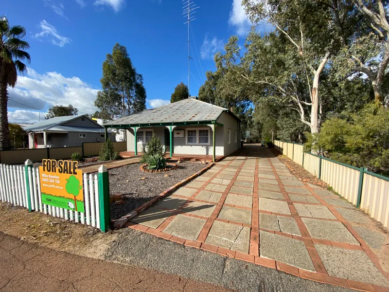 Location, location, beautiful character home.