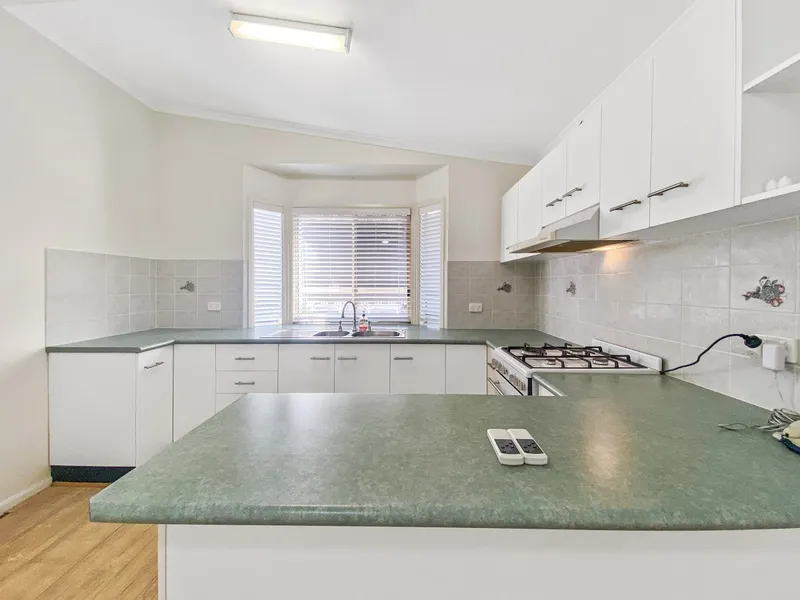 BEAUTIFULLY PRESENTED HOME WITH NEW FLOOR!