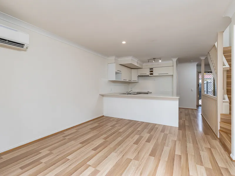 Rare tri-level townhouse unit on particularly convenient location with peaceful forest views