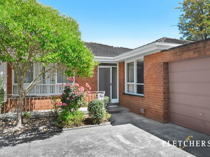 LIGHT-FILLED COMFORT ON A SERENE SINGLE LEVEL