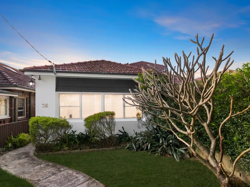 A private and elegantly renovated double brick semi in ideal location