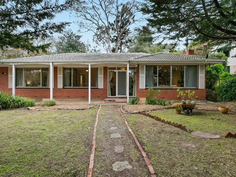 1970's Solid brick home with an elevated outlook ... and in a top spot!
