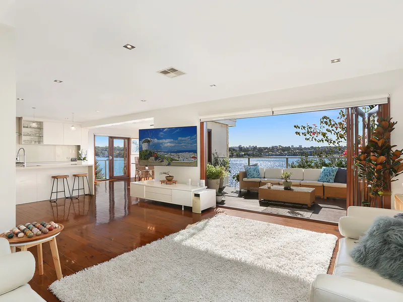 Deep waterfront family haven set against tranquil river backdrop