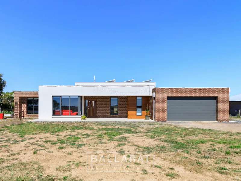 IMPRESSIVE FAMILY HOME IN RURAL SETTING ON APPROX. 1 ACRE