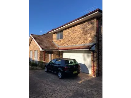 Located at the front of a small complex of 5