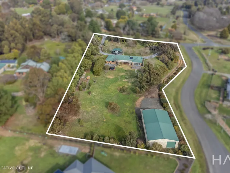 Expansive home with space and an outlook, 18x10 shed, a 4-car garage, and the perfect family-friendly layout