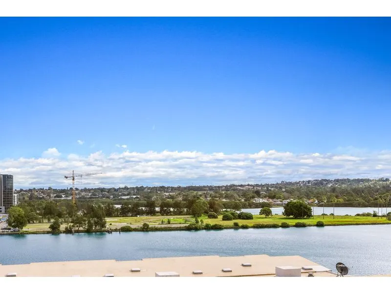 Three Bedroom Apartment with Generous Timber Floor Area in Prestige Riverside Location with Water View and Wrap Around Balcony, Perfect North Aspect 