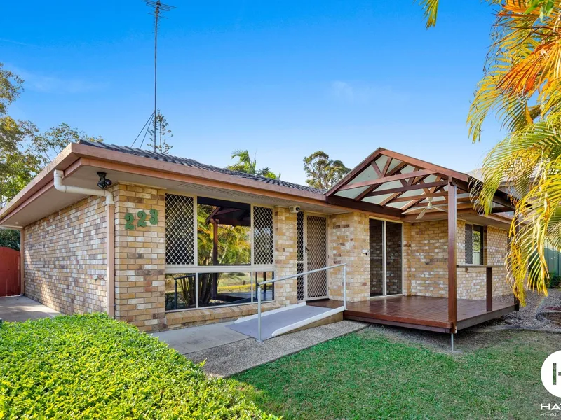 Lovely home with Large yard, drive through carport,