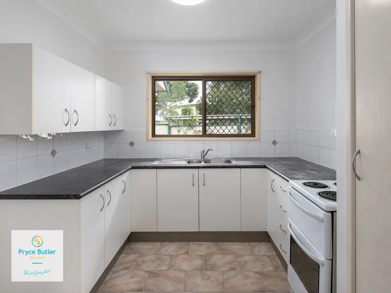 AIR-CONDITIONING... LARGE BEDROOMS... QUIET STREET... WALK TO SHOPS & TRANSPORT...
