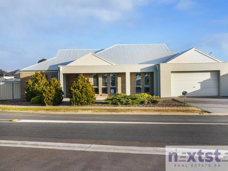 Dressed to impress, modern contemporary, 4-bedroom family home with formal lounge, family room, and large theatre room
